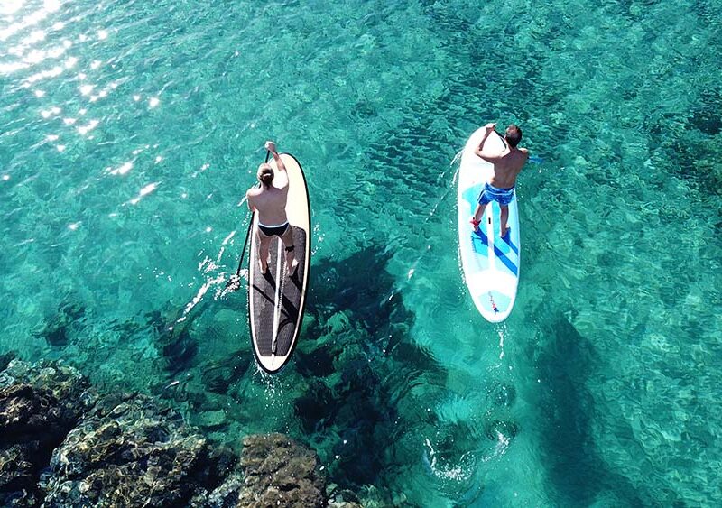 two-men-stand-up-paddling-in-maui-ocean